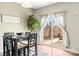 Cozy dining area with table, chairs, and sliding glass doors leading to a patio at 12614 Chantrey Way, Huntersville, NC 28078