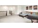 Loft area with a sectional sofa and ottoman overlooking the stairs at 12614 Chantrey Way, Huntersville, NC 28078