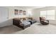 Comfortable living room with a sectional sofa, ottoman, and carpet flooring at 12614 Chantrey Way, Huntersville, NC 28078