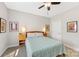Comfortable bedroom featuring ceiling fan, artwork, and natural light at 1323 Stack Rd, Monroe, NC 28112