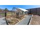 Well-maintained chicken coop with an enclosed run and a feeding area for raising poultry at 1323 Stack Rd, Monroe, NC 28112