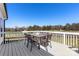 Outdoor deck with a dining table and chairs, perfect for enjoying meals outside at 1323 Stack Rd, Monroe, NC 28112