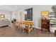 Dining area with a wooden table and chairs, modern art and views to the living room at 1323 Stack Rd, Monroe, NC 28112