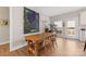 Stylish dining area with natural light, wooden table with chairs and a modern light fixture at 1323 Stack Rd, Monroe, NC 28112