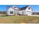Charming two-story home with white siding, black shutters and a well-manicured lawn at 1323 Stack Rd, Monroe, NC 28112