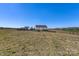 Scenic view of the house and property surrounded by lush green fields and trees at 1323 Stack Rd, Monroe, NC 28112
