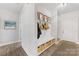 Charming foyer with built-in bench, coat hooks, and storage baskets at 1323 Stack Rd, Monroe, NC 28112