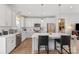 Contemporary kitchen featuring white cabinets, stainless steel appliances, a center island with seating and pendant lights at 1323 Stack Rd, Monroe, NC 28112