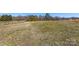 Expansive land with a home in the distance offering plenty of room to build at 1323 Stack Rd, Monroe, NC 28112