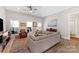 Bright living room featuring a comfortable sofa, large windows, and stylish decor at 1323 Stack Rd, Monroe, NC 28112