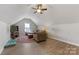 Comfortable living room with a ceiling fan, bright window, and attractive colorful rug at 1323 Stack Rd, Monroe, NC 28112