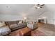 Inviting living room featuring a sofa, plush chair, and an colorful area rug at 1323 Stack Rd, Monroe, NC 28112