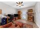 Office with two monitors, blue cabinet and bookshelves at 1323 Stack Rd, Monroe, NC 28112