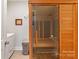 Indoor sauna room next to a washer and dryer at 1323 Stack Rd, Monroe, NC 28112