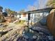 Backyard with stone-lined pond and steps to deck at 134 Weaver Hill Dr, Statesville, NC 28625