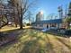 Exterior view of home with large front yard and landscaping at 134 Weaver Hill Dr, Statesville, NC 28625