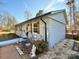 Exterior view of the home with light brick, wooden shutters, deck, and landscaped yard at 134 Weaver Hill Dr, Statesville, NC 28625