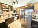 Efficient kitchen featuring stainless-steel appliances, light countertops, and ceramic tile flooring at 134 Weaver Hill Dr, Statesville, NC 28625