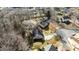 Aerial view of home and neighborhood lined with mature trees at 13701 Dawlish Ln, Pineville, NC 28134