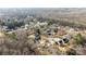 High aerial view of a home and neighborhood with mature trees at 13701 Dawlish Ln, Pineville, NC 28134
