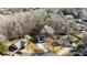 Aerial view of a home with a large backyard in a tree filled neighborhood at 13701 Dawlish Ln, Pineville, NC 28134