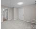 Cozy bedroom features carpet, neutral walls, and a bright overhead light at 13701 Dawlish Ln, Pineville, NC 28134