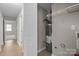 A hallway view showcasing access to utilities and additional spaces in the home at 13701 Dawlish Ln, Pineville, NC 28134