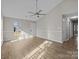 Open concept living room with lots of natural light, vaulted ceiling and hardwood floors at 13701 Dawlish Ln, Pineville, NC 28134
