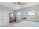 Serene bedroom with ample natural light, ceiling fan, dresser and calming artwork at 13923 Jacks Ln, Pineville, NC 28134