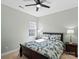 Bright bedroom with stylish decor, including a decorative bedspread and matching bedside lamps at 13923 Jacks Ln, Pineville, NC 28134