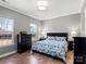 A serene bedroom featuring neutral colors, hardwood floors, and ample natural light at 13923 Jacks Ln, Pineville, NC 28134