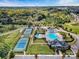 Aerial view of community amenities, including a pool, tennis courts, clubhouse, and playground at 13923 Jacks Ln, Pineville, NC 28134