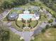 Stunning aerial view of community pool, tennis courts, clubhouse, and playground at 13923 Jacks Ln, Pineville, NC 28134