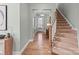 A welcoming entryway showcases hardwood flooring, a staircase, and ample natural light at 13923 Jacks Ln, Pineville, NC 28134