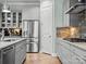 Kitchen details showcasing gray cabinets, stainless steel appliances and hardwood floors at 13923 Jacks Ln, Pineville, NC 28134