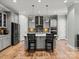 A modern kitchen island featuring granite countertops and stainless steel appliances at 13923 Jacks Ln, Pineville, NC 28134