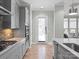Kitchen area with stainless steel oven, hardwood flooring and access to backyard area at 13923 Jacks Ln, Pineville, NC 28134