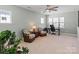 Inviting space filled with natural light, a ceiling fan, and plenty of space for entertaining at 13923 Jacks Ln, Pineville, NC 28134