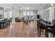 Spacious living room flows into the kitchen, featuring hardwood floors and plenty of natural light at 13923 Jacks Ln, Pineville, NC 28134