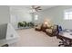 Relaxing living room featuring plenty of plants, a ceiling fan, and comfortable chairs at 13923 Jacks Ln, Pineville, NC 28134