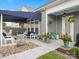 Inviting covered patio with comfortable seating, decorative planters, and a charming fountain, perfect for relaxation at 13923 Jacks Ln, Pineville, NC 28134