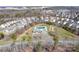 An aerial view shows the community pool and playground are centrally located to homes in the neighborhood at 203 Waterlemon Way, Monroe, NC 28110