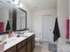 Bathroom with double vanity, a toilet, and a mirror at 203 Waterlemon Way, Monroe, NC 28110