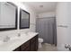 Bathroom with double vanity sinks, mirror and toilet at 203 Waterlemon Way, Monroe, NC 28110