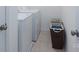 Functional laundry room with a washing machine, dryer, and storage baskets for organization at 203 Waterlemon Way, Monroe, NC 28110