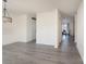 Bright and airy living room featuring modern gray flooring and abundant natural light at 203 Waterlemon Way, Monroe, NC 28110