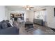 Inviting living room with hardwood floors, a fireplace, and a cozy seating area for relaxation at 203 Waterlemon Way, Monroe, NC 28110