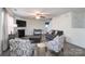 Cozy living room with fireplace, ceiling fan and neutral paint at 203 Waterlemon Way, Monroe, NC 28110