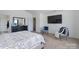 Relaxing main bedroom with large TV, sitting area, and ensuite access at 203 Waterlemon Way, Monroe, NC 28110