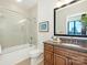 Bathroom with tiled shower/tub, granite countertop vanity, and contemporary fixtures at 222 S Caldwell St # 1803, Charlotte, NC 28202